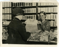 Publicity photo of Mary working in a department store, incognito, to gain experience as a saleslady prior to working on the film My Best Girl - 1927 