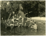 Mary Pickford serves tea to the crew of Tess of the Storm Country after filming a scene in her pool at Pickfair - 1922