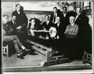 United Artists formation: 1. Dennis O'Brien, lawyer 2. Hiram Abrams, lawyer 3. Witness 4. Mary Pickford 5. William Gibbs McAdoo, consultant 6. unknown 7. Douglas Fairbanks 8. Witness -- Seated: 1. D.W. Griffith 2. Oscar Price, lawyer - 1919 
