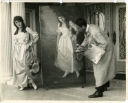 Mary Pickford posing for artist Matteo Sandona in her home on Fremont Place, Los Angeles. The life-size portrait was for the National Gallery in Washington, D.C. - 1919