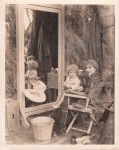 rb582 - Mary sits with baby in director chair, Sparrows 1926