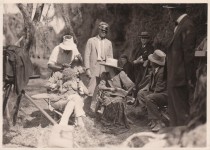 rb588 - Man sits with baby on lap with Mary in hat & staff, Sparrows 1926