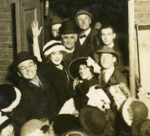 Mary Pickford greeted by fans outside a theater, 1913