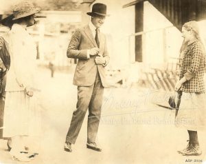 Frances Marion, Jesse Lasky and Mary Pickford dressed as Unity Blake on set of Stella Maris