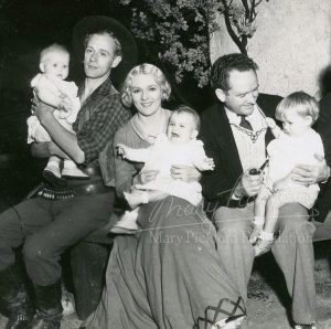 Mary with Leslie Howard and director Frank Borzage with various children from the film