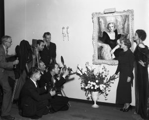 Mary with Greenman being photographed with painting (1935)